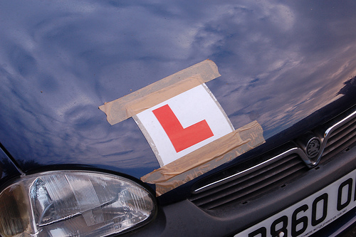 Learner driver plate on the bonnet of a car